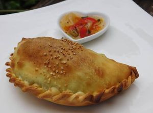 Empanada argentina con salsa picante at Cafayate Empanadas Argentinas in Cuenca