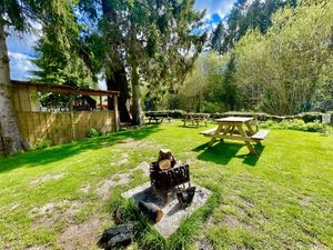 Back of outside bar with log fire pit   at Horseshoe Hotel in Whitby