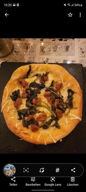 My vegan spinach pizza with cheese and faux meat. So filling! at Origami in La Spezia