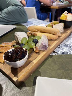 Cheese plate with cashew based blue cheese, Camembert, fruit and nuts  at Origami in La Spezia
