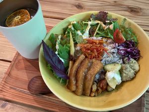 Buddha bowl and orange drink.  at ne - Plant-based Cafe & Act in Yakushima