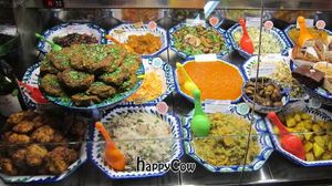 The daily menu inside the deli case at El Piano - Malaga in Malaga