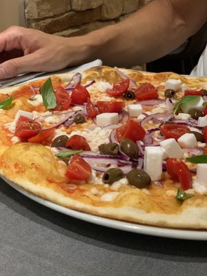 Pizza Greca Vegana with rice mozzarella, olives & cherry tomatoes  at Pizzeria Daniela in Montebelluna