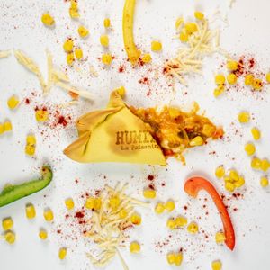 Humita: 
Corn, onion, peppers, milk, smoked paprika, ground chili, and heart of mozzarella. at La Paisanita in Prague