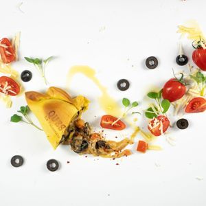 Queso: 
Three types of cheese Mozzarella, Emmental and Gouda, caramelized onions, fresh tomatoes, olives, fresh oregano, and Argentinian spices. at La Paisanita in Prague