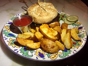 Homemade Veggie Burger (vegan with no dressing) with Gypsy fries at The Den Cafe in Santa Ana