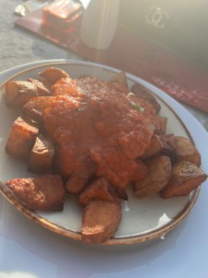 Vegan potatoes cooked with tomato sauce at La Casa Flamenca in Portsmouth