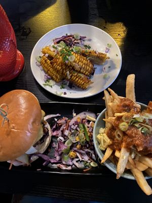 jungle is massive burger with jerk fries and corn to be wild side dish  at Jungle Bird in Birmingham