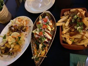 caulk tacos, fritters and loaded fries  at Jungle Bird in Birmingham