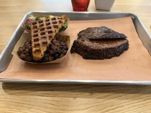 Impossible cut brisket and some sides  at Pure Grit BBQ in New York City