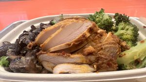 BBQ “chicken” with generous and delicious sides  at Pure Grit BBQ in New York City