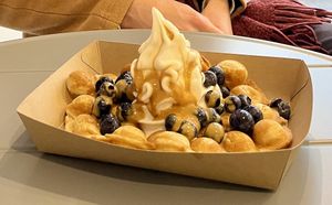 Vegan waffle with blueberries and caramel sauce   at YOMARO in Luebeck