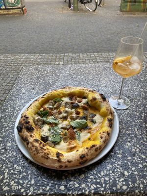 Kirby pizza- with pumpkin crème, Al’s mozzarella, vegan sausage and roasted eggplant.   at Al Catzone Pizza Napovegana in Berlin