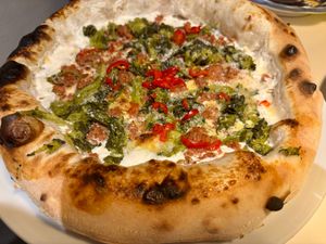 Pizza with broccoli rabe and sausage at Al Catzone Pizza Napovegana in Berlin