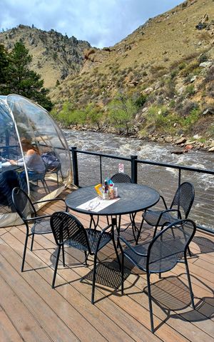 Dining river side at The Mishawaka in Bellvue