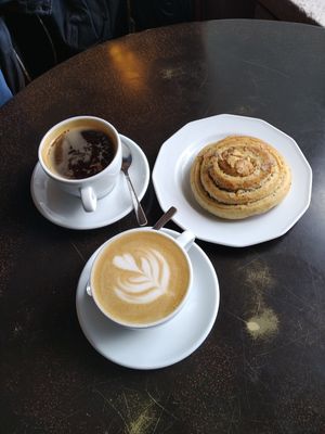 Oatly in coffee, vegan almond and cardemon bun which is delicious at CaféArt in Turku