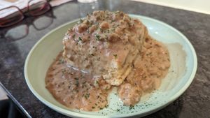 Need to ask for the vegan version -- Southern Belle 

Our classic velvety Southern sausage gravy served over either one or two biscuits • $6/$9 at Preservation Biscuit Company in Falls Church