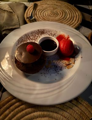 Vegan chocolate cake with chocolate sauce and raspberry ice-cream  at Nomad in Marrakech