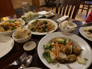 Mixed vegetables dish, drunken noodles and red curry.   at Kao Thai Restaurant in Silver Spring