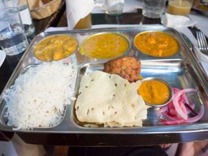 Thali – which is a huge indian plate consisting of different curries and additional portions of rice, pakora, papadam (the thin bread) and pickled onions at Veggie Garden - Dels Angels in Barcelona