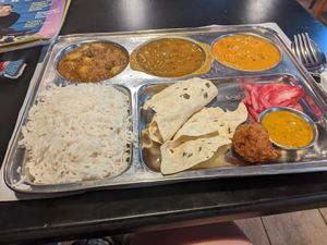 The classic Thali with 2 Curries, 1 Dal, rice, Papadams, pickled onions, pakora and dip at Veggie Garden - Dels Angels in Barcelona