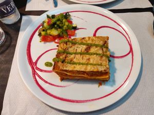 Lasaña vegetal con queso vegano y ensalada italiana at Veggie Garden - Dels Angels in Barcelona