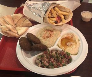 A mezze platter (with extra pita to substitute for the chicken-broth rice), and a build-your-own pita.  at Celo's in Melbourne