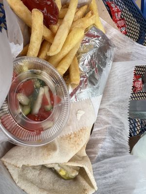 Falafel pita with a side of fries and cucumber tomato freshie salad.  at Celo's in Melbourne