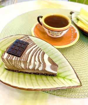 Raw vegan "Three Chocolates" cake and date decaf coffee. at SweetLi by Lilit in Yerevan