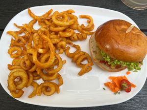 Red Vegan Burger with curly fries  at Tommy's Braterei in Bad Kissingen