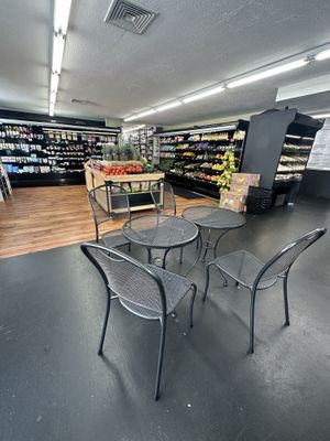 Cafe tables in produce area  at Rory's Market in Dennis Port