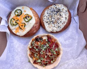 Jalapeño cheddar bagel bomb, everything bagel bomb, and ratatouille tart    at Organicos Bakery in Phoenix