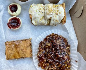 Strawberry rhubarb jammers, pistachio pull-apart bread, hazelnut baklava (oh my!), and maple pecan sticky bun  at Organicos Bakery in Phoenix
