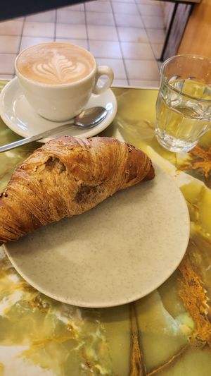 Cappuccino mit Hafermilch und Dinkelcroissant at Cafe Hanseatica in Tubingen