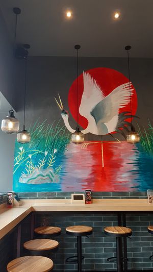 Lovely mural by single seating area at Grounded Kitchen in Headington