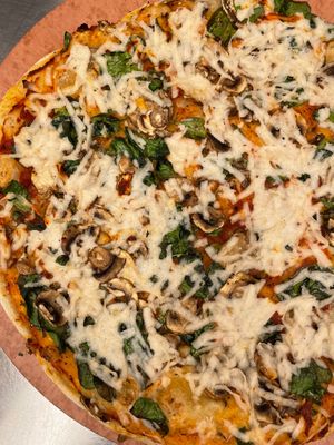pizza with cashew cheese, marinara, & veggies at Arizmendi Bakery and Pizzeria in Emeryville