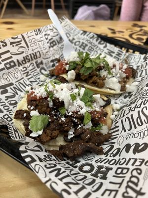 Two Tacos (Tortillas, Two Meats: Carne Asada & Jerk Chicken, Salsa, Onion, Cilantro, and Cotija Cheese  at Plant Based Boss in Hickory