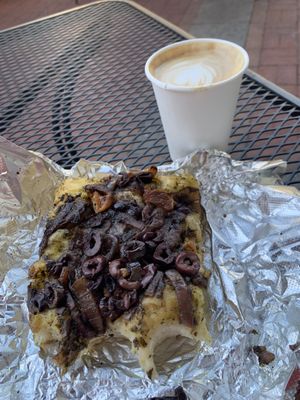 Delicious vegan focaccia and a soy milk latte. They’ll heat the focaccia for you! Unfortunately they don’t have vegan pizza at this location but this hit the spot!   at Arizmendi Bakery in San Rafael
