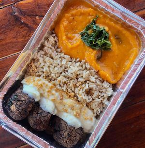 feijoada dumplings stuffed with kale, brown rice, pumpkin puree and garlic cauliflower mayonnaise at Nabati Comida Vegana in Natal