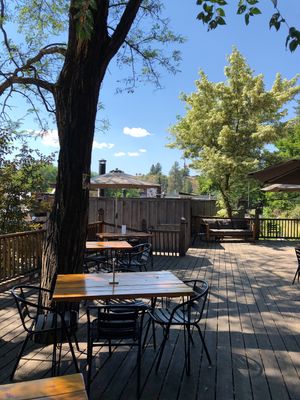 Outdoor seating area under the trees! 🌲😍  at Jupiter in Winthrop