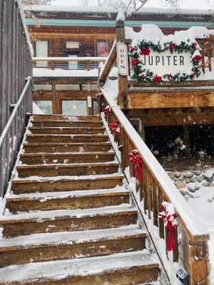 Stairs off Riverside Avenue to the deck and front door at Jupiter in Winthrop