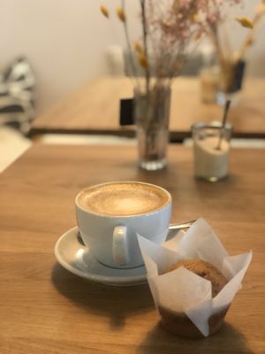 Muffin and oatmilk cappuccino doppio  at Café August in Freiburg