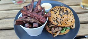 Pulled oyster mushroom burger with sweet potato fries. at The Life in Lisbon