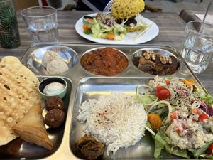 Asian platter at front, burger and brochettes at rear  at Le Shanti in Dijon