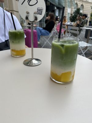 ice mango matcha latte  at Oats Day Long in Brussels