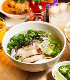 Vegan Pho - Noodle soup with vegetable broth with baby bok choy, shiitake mushroom, beansprouts, onion, scallion, and cilantro at Plum in New York City