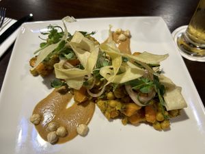 Sweet potato & chickpeas with hazelnuts & parsnip crisps.   at Bartley's in Dublin