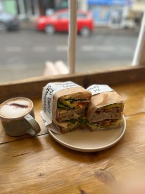 Cappuccino. L- Tomato, mozzarella (vg) and basil sandwich. R- BLT  at The Tinker's Granddaughter in Lymington
