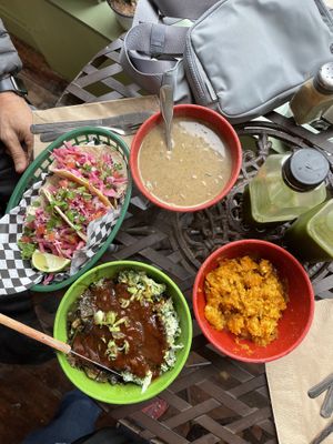 Street tacos, black bean soup, bbq portobello with collards and broccoli salad, butternut squash sweet potato smash and green juice  at Green Door Cafe in Astoria