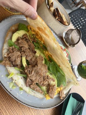 fried rice pancake, with avocado and scrambled tofu eggs inside. I added toast and soy chunks to this plate. The tomato sauce was delicious 💚  at Pink in Warsaw